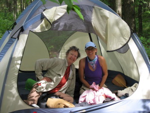 Two happy campers enjoy a relaxing stay along the river.
